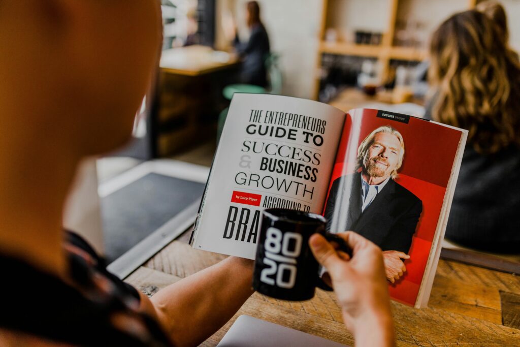 Person reading a business growth guide for lead generation tips
